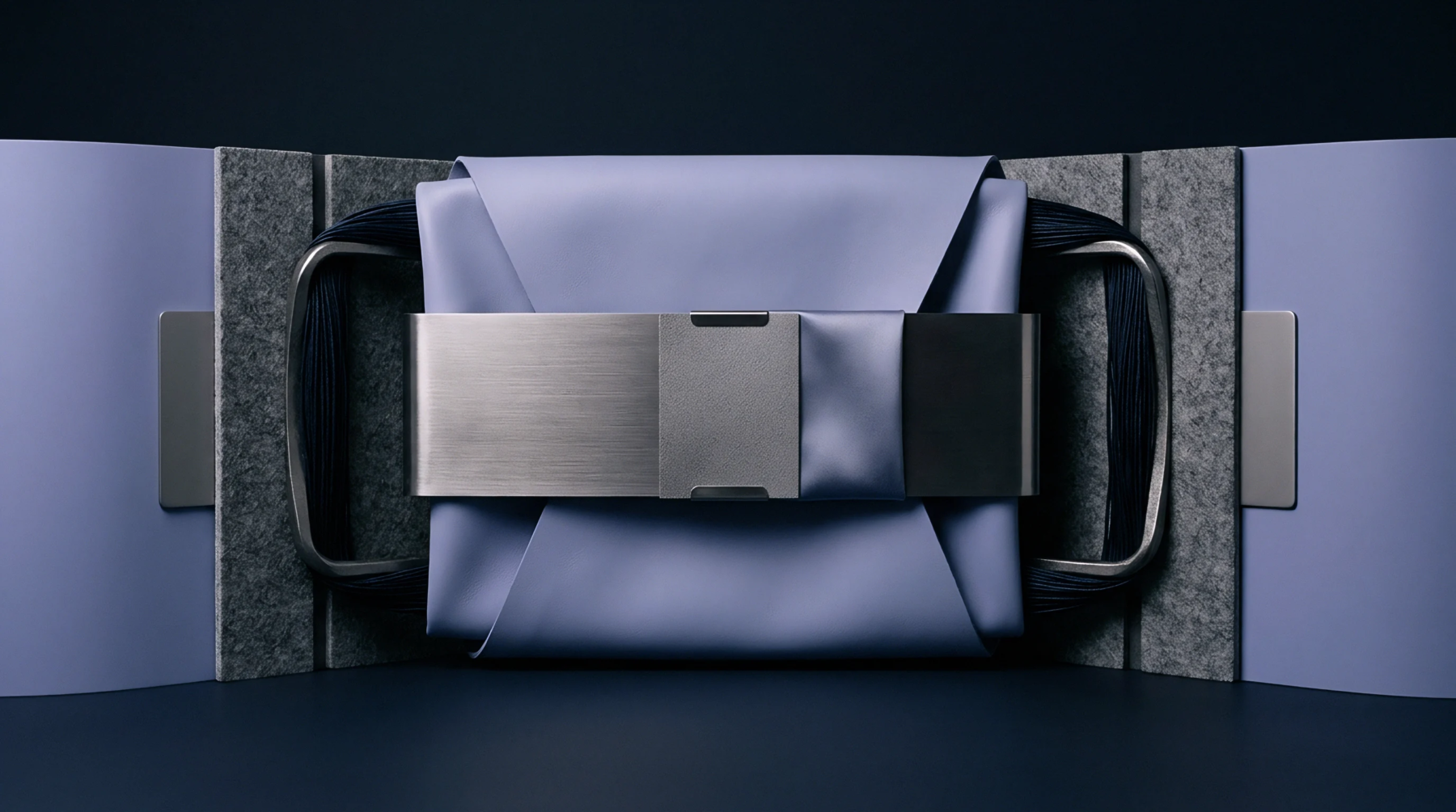 A folded elastomeric sheet is secured by a brushed metal tension band between gray felt blocks in a digital render.